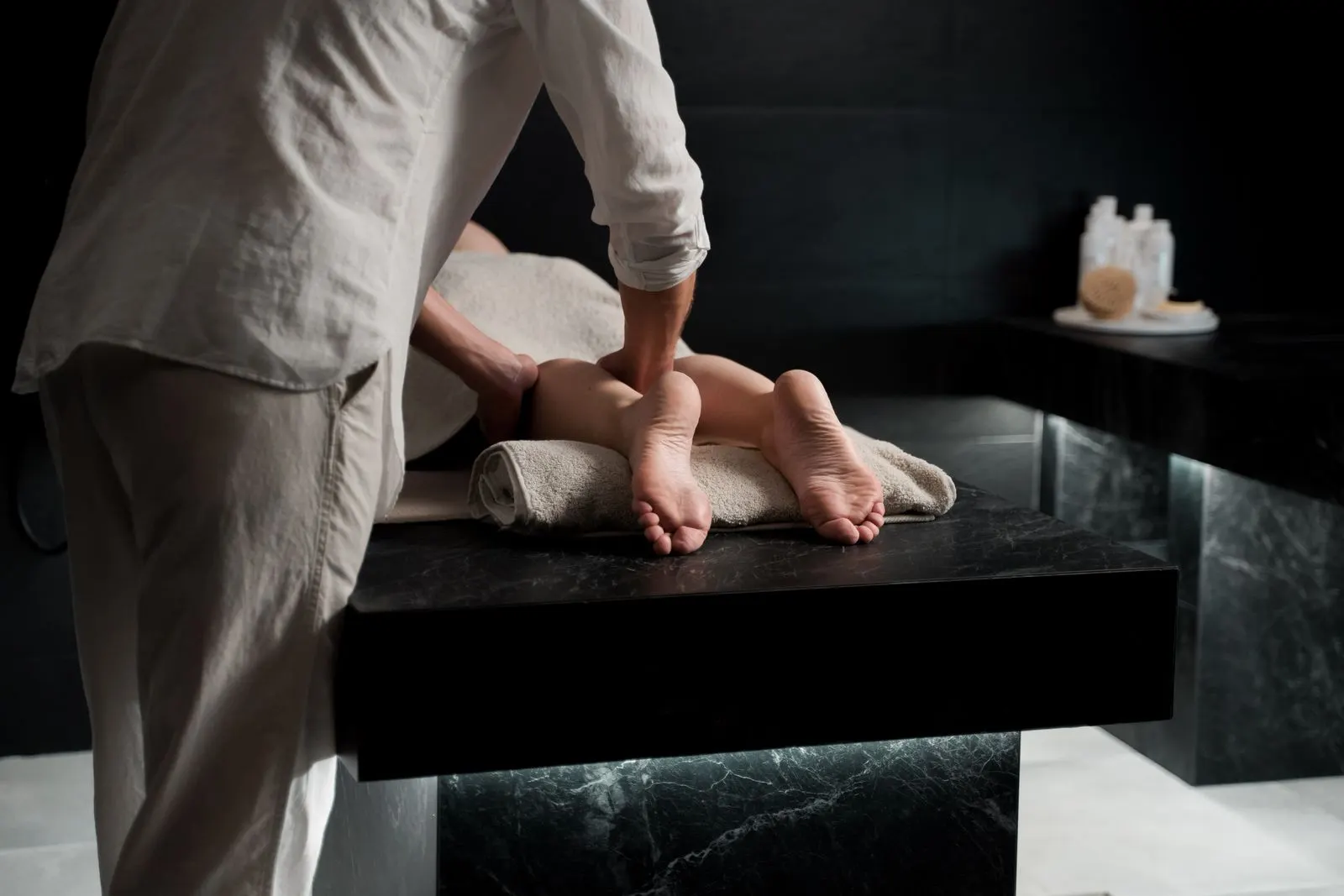 Relaxing foot and leg massage session at a calm spa room, representing Spa in Gurgaon's Sohna Road service
