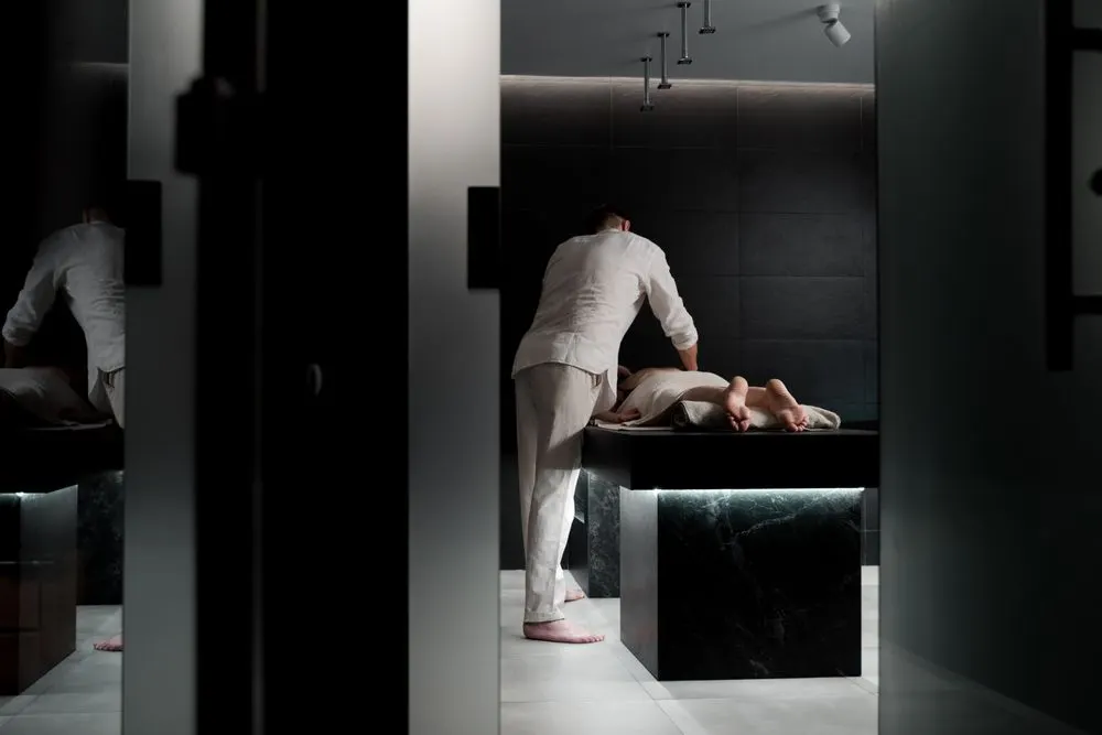 Guest enjoying a relaxing spa treatment - frequently asked questions about our Sohna Road massage service